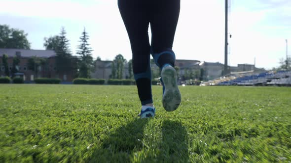 Senior woman running at sunset