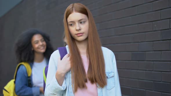 Ashamed Red-Haired Teenager Passing by Laughing Classmates College Bullying