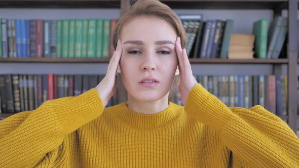 Headache Portrait of Tense Woman in Office