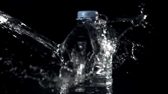 Super Slow Motion of the Jet of Water Falls on the Water Bottle