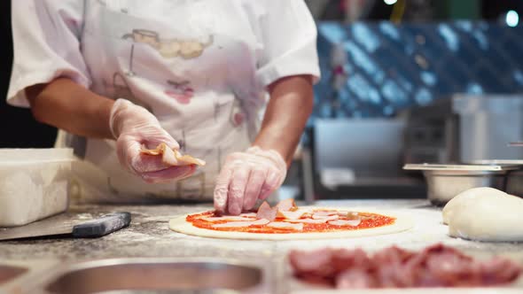 Chef Prepares Pizza Spreads Pieces Of Bacon On Raw Prepared Dough Dressing Preparing Pizza Baking