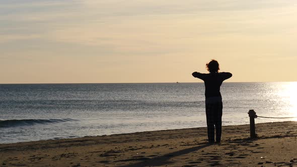 Woman Exercise on Beach at Morning