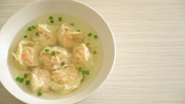 shrimp dumpling soup in white bowl - Asian food style