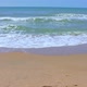 Sea Wave with Foam Runs on a Sandy Beach on a Sunny Summer Day - VideoHive Item for Sale