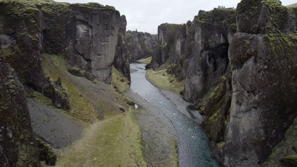 Flying up river through the massive walls of the majestic Fjadrargljufur canyon