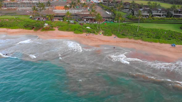 Beautiful epic 4k Drone shot in Maui near Kihei flying towards beach. Must see