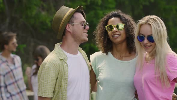 Carefree Male and Female Friends Hugging and Dancing Together, Enjoying Life