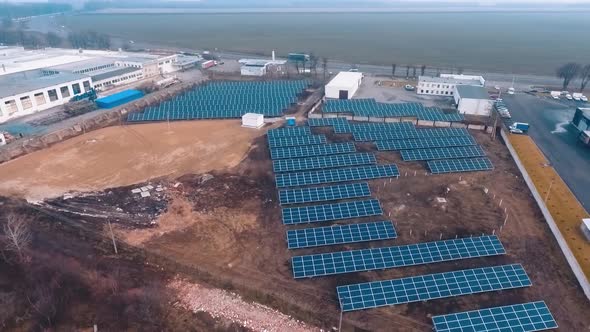 Solar panels on energy farm in rural. Aerial view of solar energy panels in countryside from above