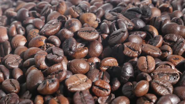 Dark roasted coffee beans  4K panning video