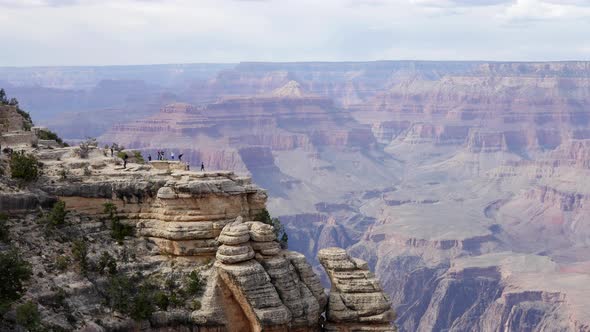 Tourists on Cliff at Grand Canyon