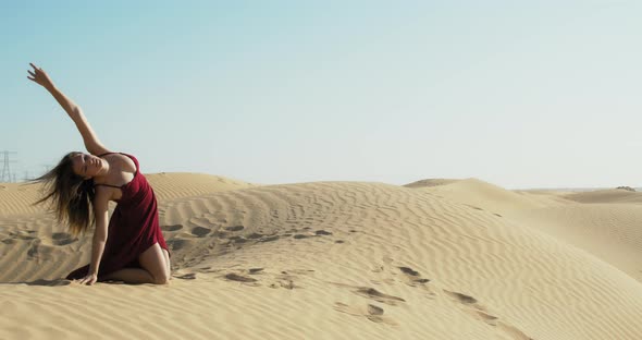 Young Model is Dancing in Rub Al Khali Desert in Dubai UAE