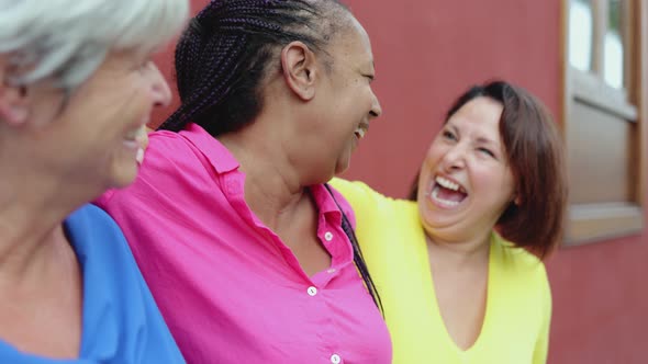 Multiracial Senior Women Meet and Greeting with Hug Outdoor in the City Real People Elderly