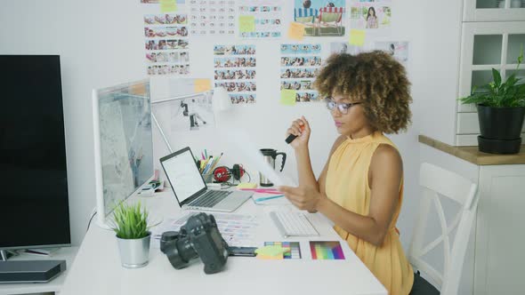 Stylish Designer Posing at Desktop