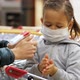 Child in Protective Mask Makes Disinfection of Hands with Sanitizer at Grocery. - VideoHive Item for Sale