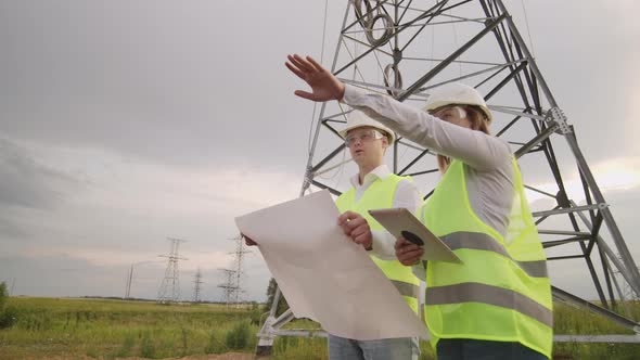 Coworking Engineers with Tablets on Solar Plant