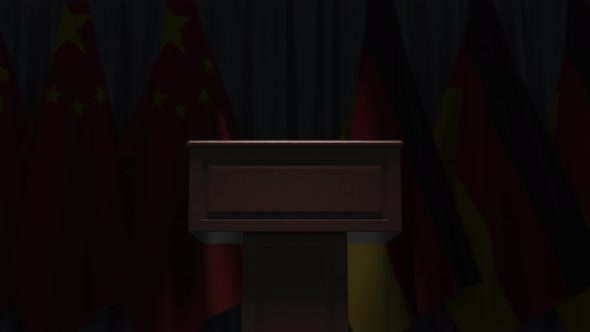 Many Flags of Germany and China Behind Speaker Tribune
