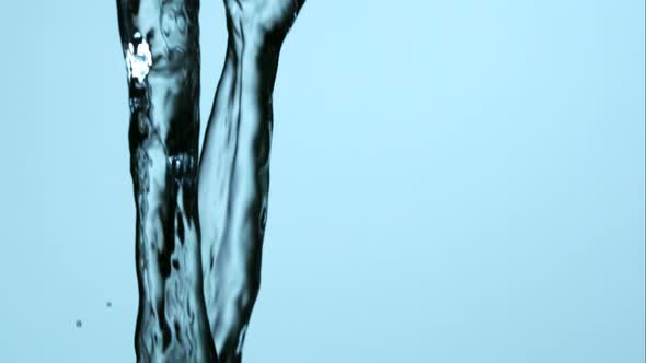 Water pouring and splashing in ultra slow motion 1500fps on a reflective surface - WATER POURS