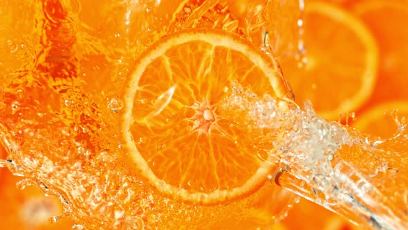 Super Slow Motion Shot of Splashing Water From Rotating Tangerine Slice at 1000Fps.