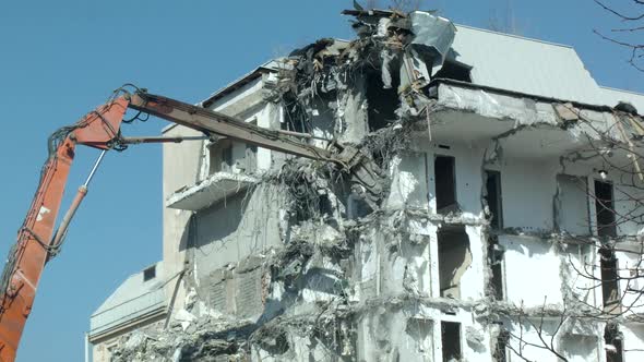 Building Demolition by Excavator  alt