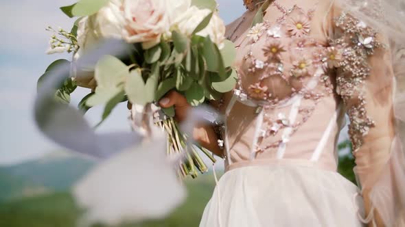 Bride's Bouquet Her Hands Ribbons Unfold Wind