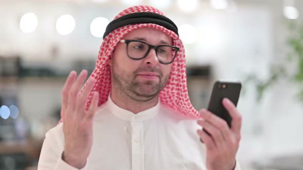 Upset Young Arab Businessman Having Loss on Smartphone