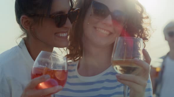 Two caucasian girls dancing the roof top in sunny day. Shot with RED helium camera in 8K.