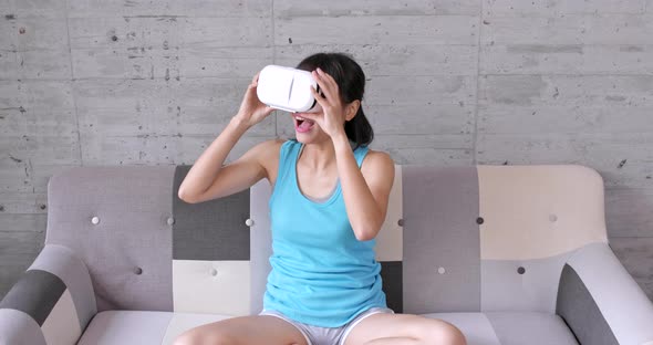 Woman wearing VR device at home