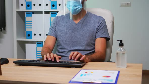 Employee Wearing Mask and Visor