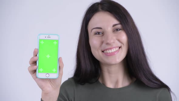 Face of Happy Young Beautiful Woman Showing Phone