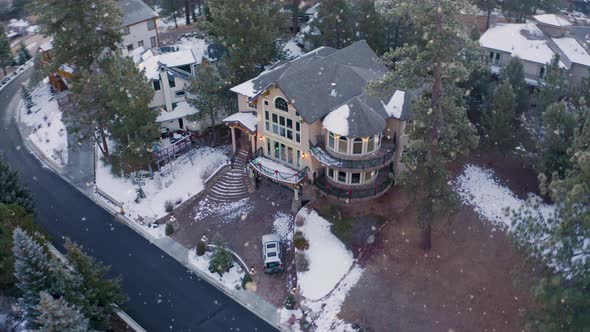 Snowcapped Mountain Mansions during beautiful snowfall Amazing Drone Flight