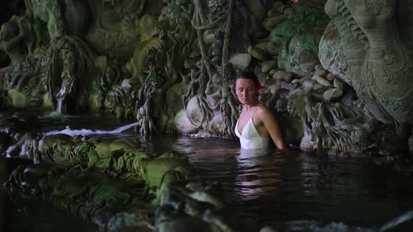 Meditating Atmosphere in Sacred Bali Pond Beautiful Woman Relaxing in the Water Spiritual Ornament