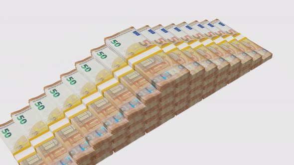 Many wads of money isolated on white background. 50 Euro banknotes. Stacks of money.