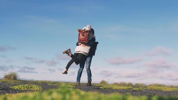 Young Loving Couple Hugging and Enjoing View on Beach in Iceland Slow Motion Low Angle View