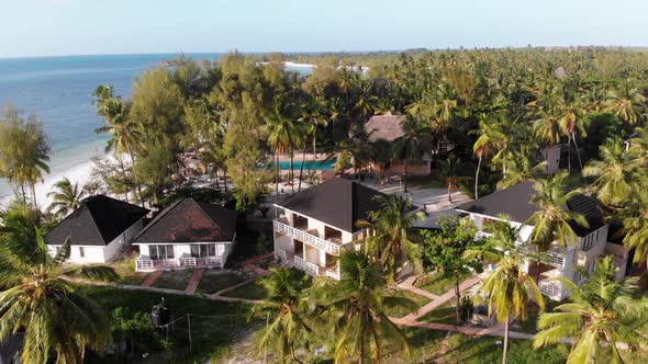 Paradise Coast Resort with Palm Trees and Hotels By Ocean Zanzibar Aerial View