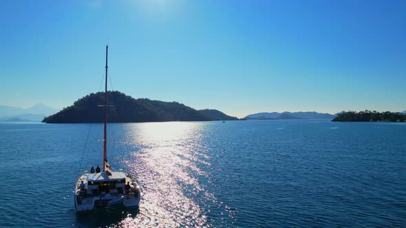 View of the Mountains on the Horizon of the Sea with Catamaran