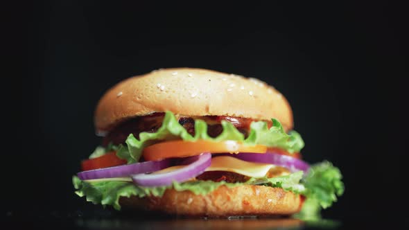 Big and Tasty Burger is Rotating on the Plate