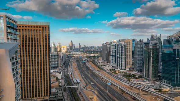 Aerial View of Dubai Marina Skyscrapers and Jumeirah Lakes Towers Timelapse with Traffic on Sheikh