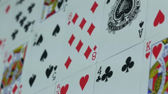 Deck Of Playing Cards Is Spread Out On The Table