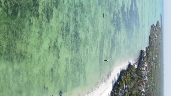 Vertical Video of the Ocean Near the Coast of Zanzibar Tanzania Aerial View