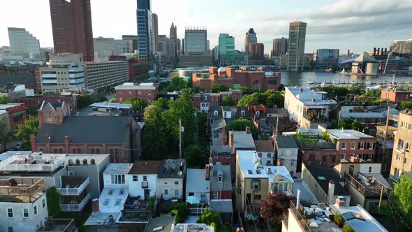 Baltimore Maryland skyline. Aerial tilt up reveal of houses and downtown cityscape.