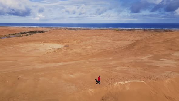 Walking on sand dunes by the sea in New Zealand