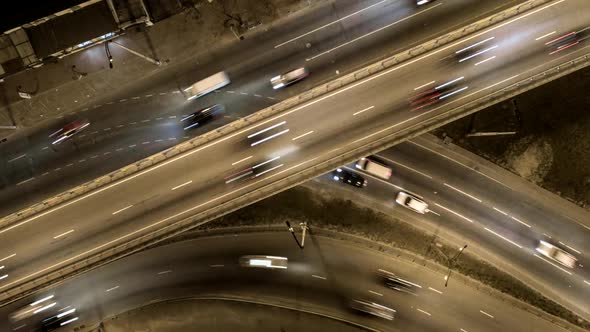 Traffic on Freeway Interchange. Aerial Night View Timelapse City Traffic