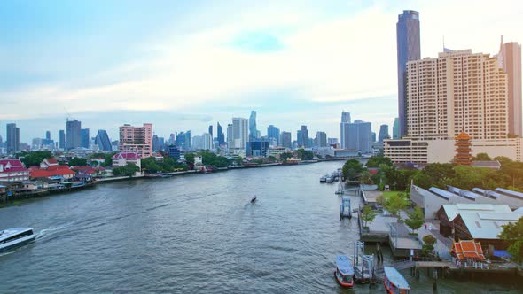 4K UHD : Bangkok River drone view. Flying over the Chao Phraya River