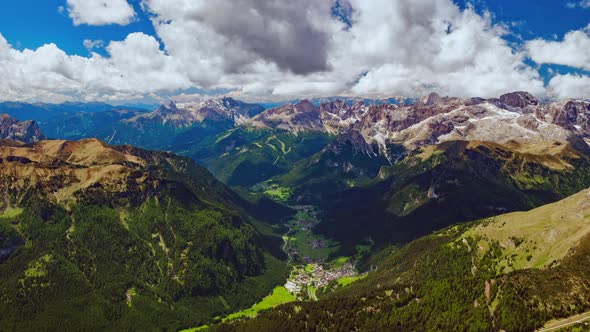 4K Aerial timelapse of of moving clouds over Campitello di Fassa, a comune in Trentino, Italy