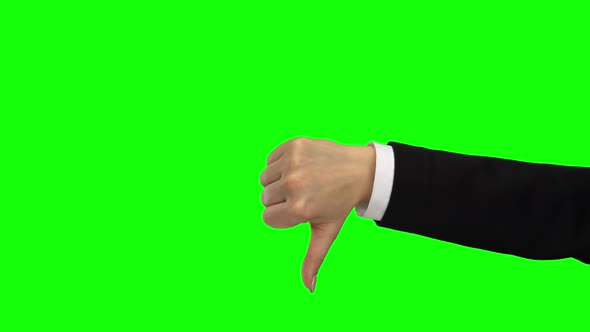 Hand of Female Showing Thumb Down. Green Screen. Close Up