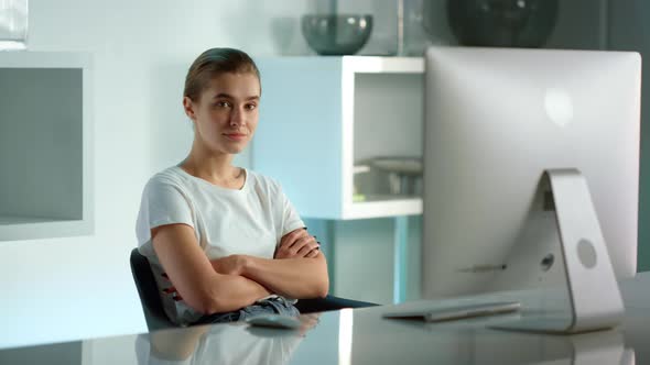 Focused Businesswoman Watching Online Show at Home