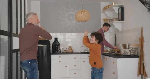 Gay Man Teaches Son Dancing While Partner Prepares Breakfast