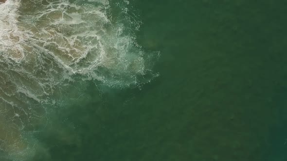 Afternoon camera down drone view from the water and waves of Redondo Beach, California. ( DJi Spark