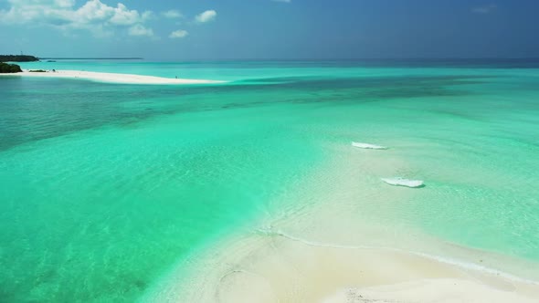 Aerial flying over scenery of tranquil lagoon beach trip by blue ocean and white sand background of 