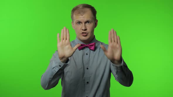 Guy Showing Stop Gesture with Hands. No, Never, Disliking and Rejecting Sign. People Emotions